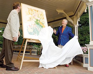 7.25.2008
Keith Kaiser, Horticulture Director of Mill Creek Metro Parks, and artist, Gary Bukovnic, reveal his work, "Golden Celebration," a painting of the parks spring bulb display during a dinner party at Fellows Riverside Gardens Friday evening.
Geoffrey Hauschild