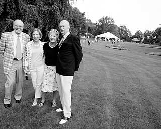 7.25.2008
Bob and Carylon Albert, of Liberty, stand alongside Roberta and Jim Lang, of Canfield taking a break for a portrait on their way to dinner during a garden party held at Fellows Riverside Gardens Friday evening.
Geoffrey Hauschild