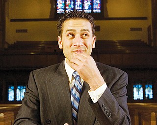 7.21.2008
Jason Melidona, a.k.a. rapper "Jay Mel" of Niles, rests on a kneeler at Trinity United Methodist Church during shooting for the music video of his song, "This Letter."
Geoffrey Hauschild
Geoffrey Hauschild