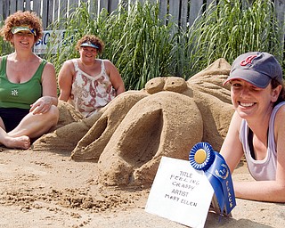 1st place: L-R The team of Pam Urquhardt of Cleveland, Jo McCaskill of N. Jackson and Mary Ellen Bonacci of Austintown won the blue ribbon for first place (and $100.00) for their crap sculpture entitled "feelin' crabby" at the sand sculpture contest in the Wick Recreation Area at Mill Creek Park on Sunday, July 27, 2008. The sculpture was inspired by a friend of Bonacci's who has a generally mean disposition. Daniel C. Britt.