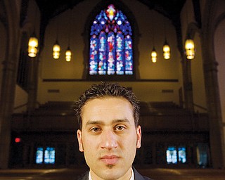 7.21.2008
Jason Melidona, a.k.a. rapper "Jay Mel" of Niles, poses for a portrait at Trinity United Methodist Church during shooting for the music video of his song, "This Letter."
Geoffrey Hauschild