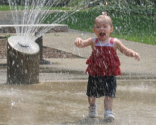 Abby Ruggles, age 18 months, runs through the fountain at the playground in Mill Creek Park. She is the daughter of Steve and Renee Ruggles of Austintown. 