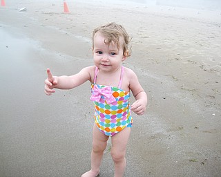 Ella Dill, 1, takes in the beach during a family trip to Niagara Falls.