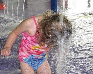 Lena Dlll, 2, daughter of Valerie and Dustin Dill of Campbell, soaks her head at an indoor water park in Niagara Falls.
