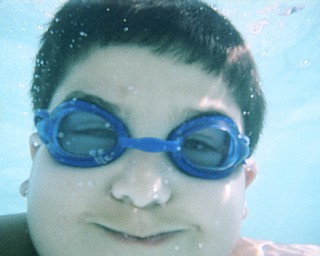 Michael John Palagano takes a dip in the hotel pool in Virginia Beach. His sister, Gina, captured the photo last summer with her underwater camera. They're children of Mike and Joanne Palagano of Boardman.