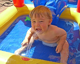 Evan Butler, 17 months, playing in the pool at home.  Parents  Brian and Susan Butler.