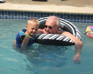 Keaton Mayhew enjoys some time with his grandfather, Dominic Barber. Both are from Boardman.