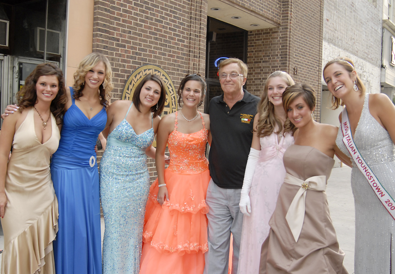 Elderly Italian men photograph one another with the girls. Daniel C. Britt. 