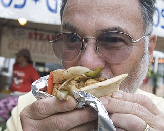 Joseph Sandy of Johnson bites into a gyro at the Warren Italian Festival Thursday, August 7, 2008. Daniel C. Britt.