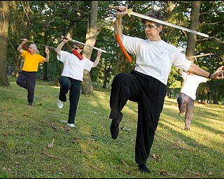 7.31.2008
(left-right)
Ed Hallahan, Evaline Abram-Diroll, Marie Lew, and Ed Istnick Jr., all residents of the North Side, practice Tai Chiin Wick Park.