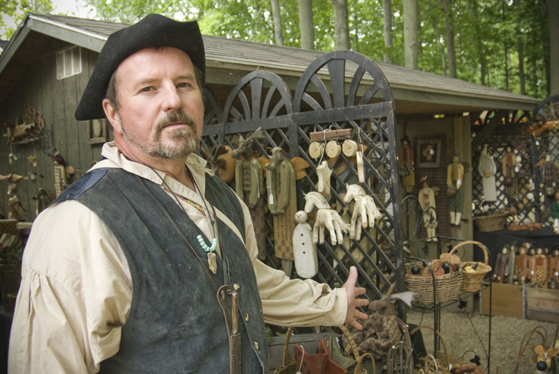 Art Blair of Girard uses a rasp to shape many of his wooden folk art sculptures. Shaker Festival, Beaver, OH Sunday, August 10, 2008. Daniel C. Britt. 