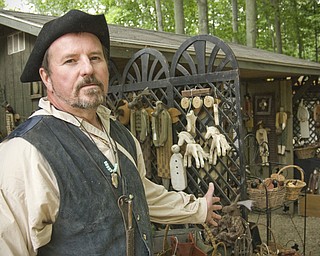 Art Blair of Girard uses a rasp to shape many of his wooden folk art sculptures. Shaker Festival, Beaver, OH Sunday, August 10, 2008. Daniel C. Britt.