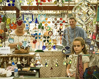 Terra Stevens, 7, of Dardenne Prarie, Missouri is a 3rd generation glass designer. Her family's company, Leaded Glass Design of Wadsworth, has had a booth at the Shaker Festival for over a decade. Daniel C. Britt.