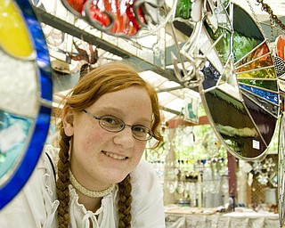 Savannah Stevens,13, of Dardenne Prarie, Missouri is a 3rd generation glass designer. Her family's company, Leaded Glass Design of Wadsworth, has had a booth at the Shaker Festival for over a decade. Daniel C. Britt.