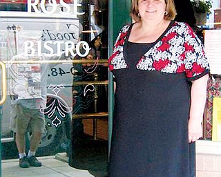 ORIGINATOR: Maria Longo stands at the door to the Green Rose Bistro, which she and her husband own. The Salem Italian Festival was her idea.
