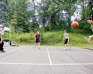 ON THE COURT: From left, Ben Stoyak, Jonathan Weisberg, Tony Pozzuto and Steve Wiesen play four square at Church Hill Park in Liberty. The four Liberty teens are trying to get into the Guinness World Records for the longest continuous game of four square. They start 9 a.m. Monday and hope to keep playing through 9 tonight.