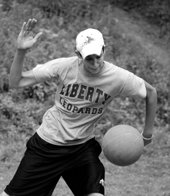 Tony Pozzutto serves the ball during a game of four square. He and some friends are trying to break the world record.