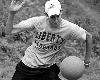 Tony Pozzutto serves the ball during a game of four square. He and some friends are trying to break the world record.