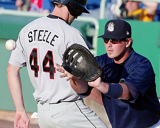 NOT THIS TIME: Scrappers first baseman Zach Booker, right, waits to make the catch as ValleyCats baserunner T.J. Steele gets back to first safely during a pickoff attempt Monday at Eastwood Field.