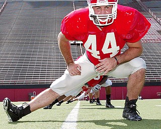 LINEBACKER PREPARATION: Linebacker Mike Barlak works his legs during Youngstown State's football practice on Monday.