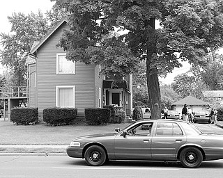 A house in the 800 block of N Park Ave. was surrounded and entered by Warren Police Tuesday afternoon in search of a person of interest in the murder of a restaurant owner and serious wounding of his son.