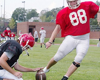 YSU kicker Brian Palmer during practice. Holding is Todd Rowan.