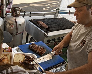 Paul Meyers of Berwyn Illinois mans the Chicago BBQ stand at the Miller Lite National Rib Cook-Off Saturday, August 16, 2008 outside the Chevy Centre. Daniel C. Britt.