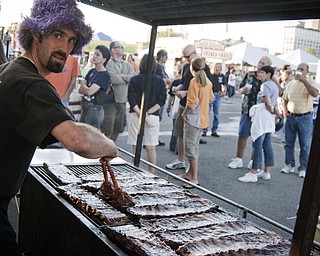 Anthony Ray soaks some ribs Saturday, August 16, 2008. Daniel C. Britt.