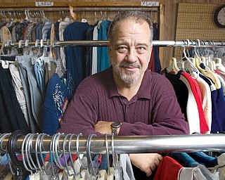 8.11.2008
Doug Herlinger, manager of the Church Mouse Thrift Shop in Newton Falls, poses for a portrait at the store which faces financial hardships. "People's needs are going up as incomes are going down," says Herlinger who admits its become increasingly hard to keep the store open, on donations and sales alone, while facing rising utilities and requests from people lacking the money to pay for their selections. 
Geoffrey Hauschild