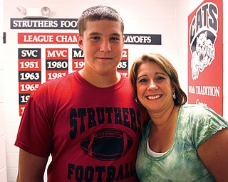  Kory George,with his mom  Janet George-Kory George, football player at Struthers High School, has received the Rudy Award for coming back from 2 knee surgeries and while recuperating, cheered his team on from the sideline.