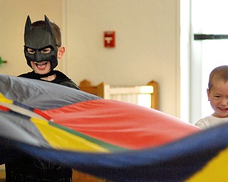 L-R Brock Baker of Canfield and his brother, Blake, participate in games at Austintown Library.