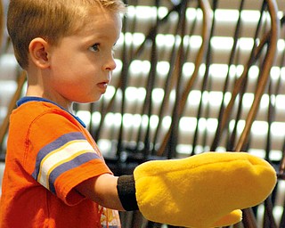 Vincent Larson of Austintown wears a glove that helps him "catch the cannon."