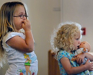Makenzie Fink and Angelina Jannone both of Austintown watch as Sara Churchill entertains them.