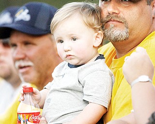 Brady, 17 months, and dad Mark Hinerc both of Brookfield watch opening night Football as Liberty beat Brookfield in the season opener,