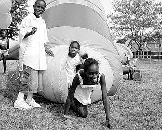 L-R Teasia Lambert, 11, of Youngstown; Kevin Maghan, 9, of Youngstown Travon Tinsley, 4, of Youngstown and Tamiara Branch, 11, of Youngstown at Community Day at the Rockford Village in Youngstown Saturday, August 23, 2008.