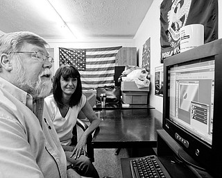 ONLINE: Gregory Wedin, a coach at the Post 290 Career Center in vienna, and manager Joann Stevens check out one of the Internet-based programs for Ohio veterans.