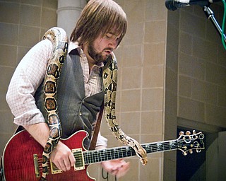 The Zou invited a 6 foot peruvian boa constrictor onto the stage at Rukus fest in Warren. Guitarist Rob Thorndike, 23, of Youngstown soloed with it wrapped about him like a slimy shawl.