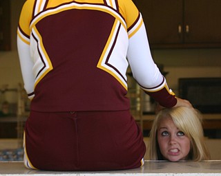 "Senior cheerleader Melissa Williams lost her head...it's time for football!!"