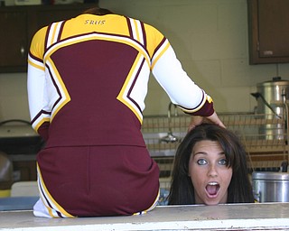 "Senior Cheerleader Christina Oddo seems to have lost her head!  There
is just so much to do to get ready for the 2008 Football Season!"