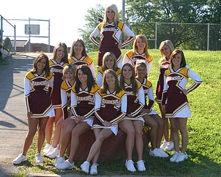 "South Range Varsity Cheerleaders are just waiting for the team to run
down the hill into the stadium on that first game of the season!"