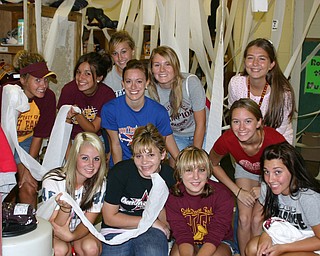 "The South Range football locker room was well decorated by these
junior and senior girls."

