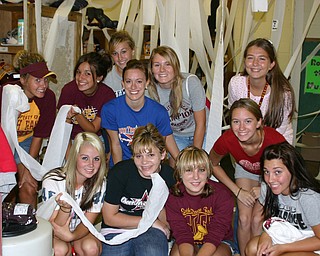 "The South Range football locker room was well decorated by these
junior and senior girls."
