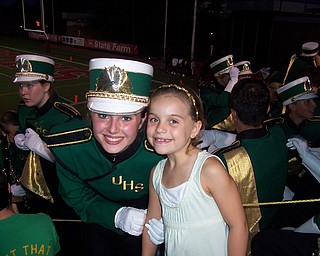 Ursuline High School student Jen Stevens '11, with future Ursuline student Angelina Sabatino '19 at Ursuline's win over Cleveland East Tech Friday at Stambaugh Stadium. 