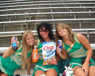 Ursuline Cheerleaders Ashley Williams, Cara Mia Gatti and Nina Ballone are feuling up for the season in their new uniforms on picture day!