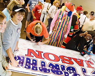 Chrysa Kovach, 17, and her brother Beau Kovach, 15, wait in line for a marker to sign a banner which will serve as Baird's birthday card a the Jason Baird Fundraiser Sunday, August 24, 2008.