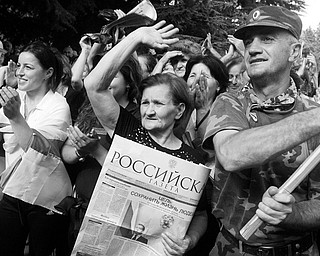 INDEPENDENCE RALLY: People holding Russian newspapers attend a rally in Tskhinvali, capital of Georgia's breakaway province of South Ossetia. The rally Wednesday was to celebrate Russia's recognition of the independence of South Ossetia.