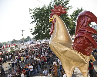 Rock around the cock: The cock, a Canfield Fair icon, oversees the crowd of thousands Saturday, August 30, 2008. Daniel C. Britt.