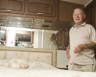 Bill Ward is camped at the Canfield Fair in a 37 ft. Tasko Horizon trailer. Here he is posing in bedroom, Saturday, August 30, 2008. Daniel C. Britt. 