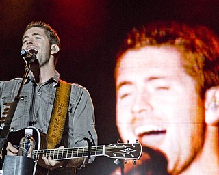 Josh Turner getting crazy with his guitar at the Canfield Fair Sunday, August 31, 2008. Daniel C. Britt.