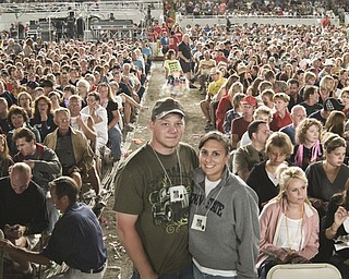 Bob Brenner, Jr., 23, and Leah Eister, 22, both of Canfield, await Josh Tucker in the front row of the grandstand auditorium at the Canfield Fair Sunday, August 31, 2008. Daniel C. Britt. 